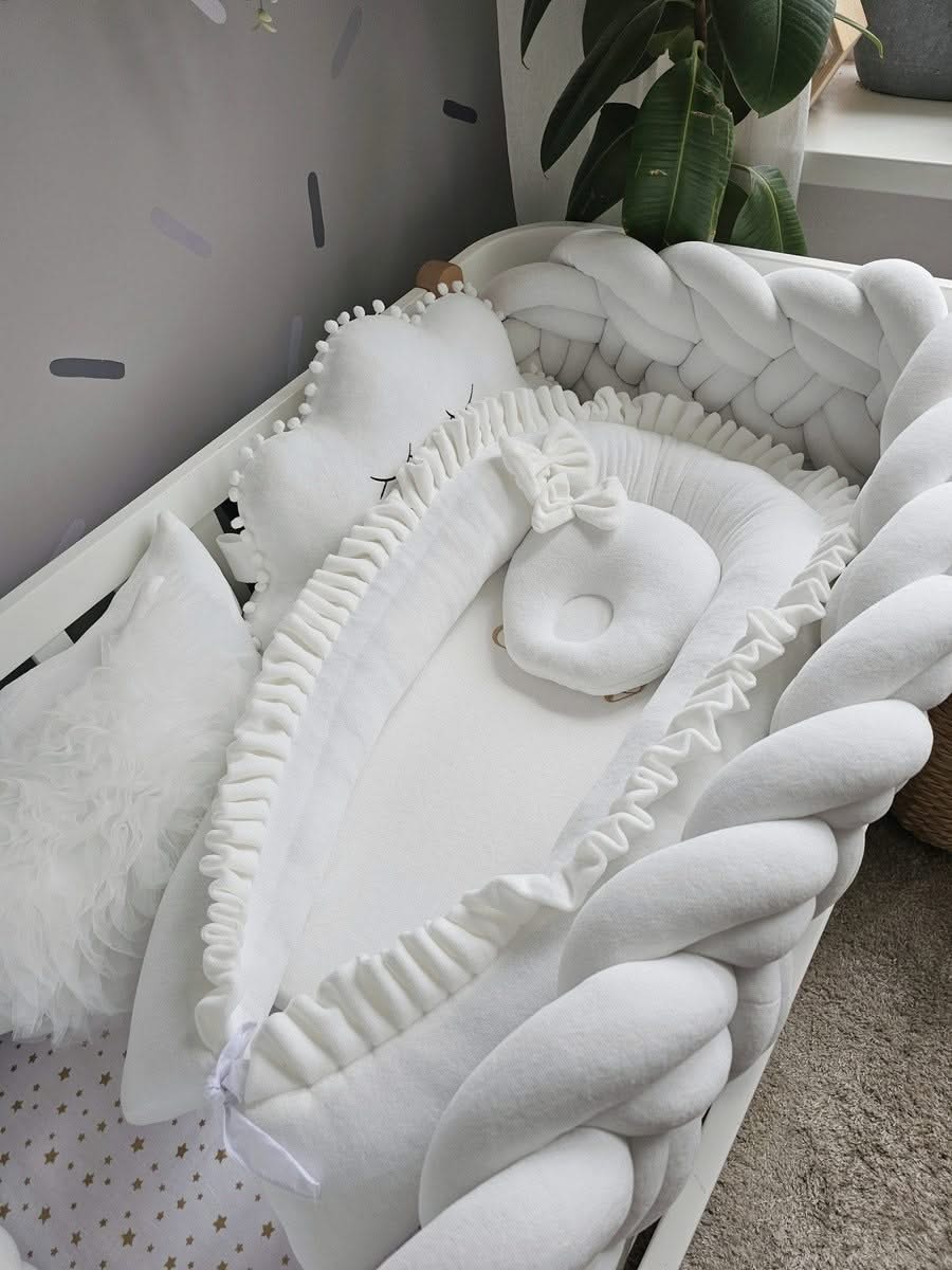 Premium creamy baby crib bedding set with braided crib bumper. KARI studio