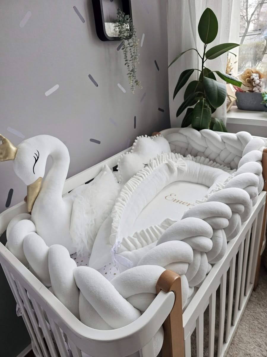 Premium creamy baby crib bedding set with braided crib bumper. KARI studio
