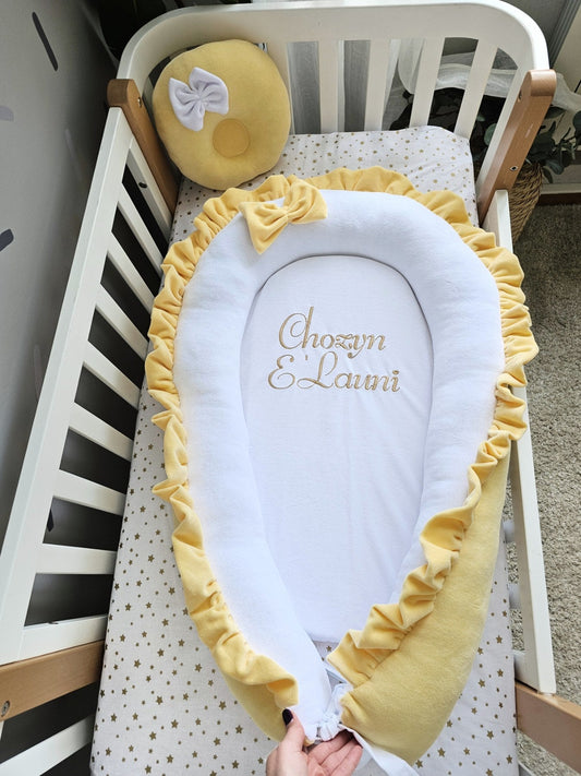 Baby nest with baby name and yellow small pillow. KAR studio