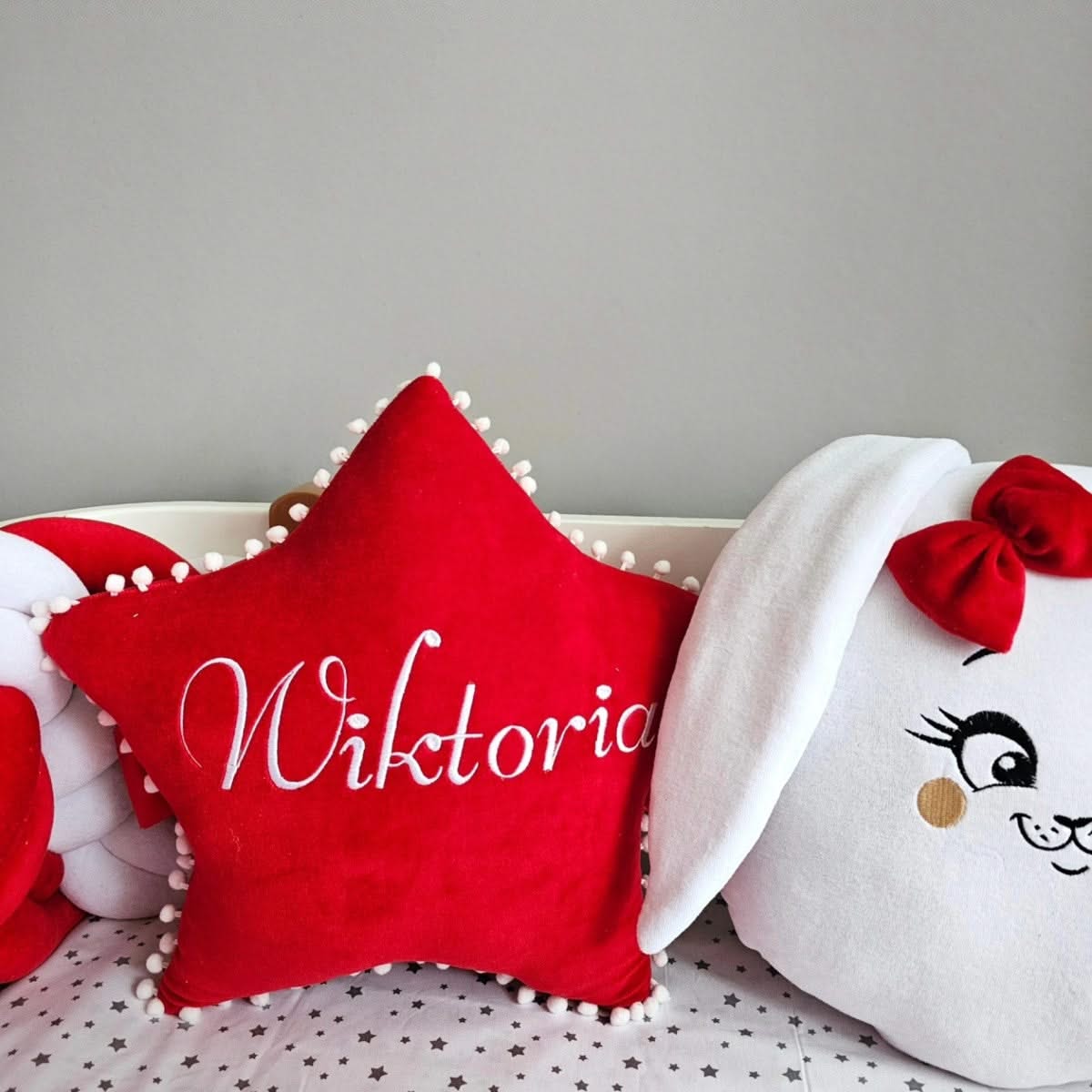 Red baby crib bedding set with braided bumper. KARI studio