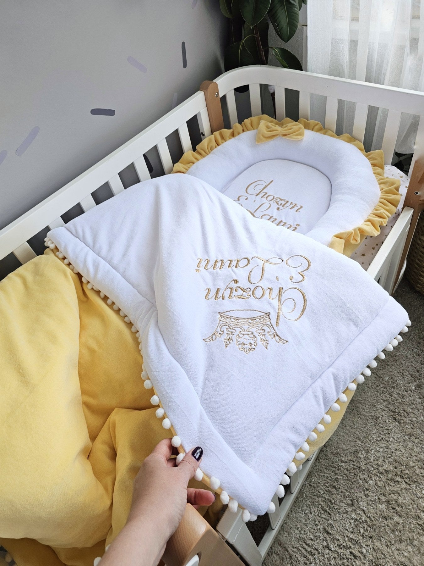 Baby nest with baby name and yellow small pillow. KAR studio